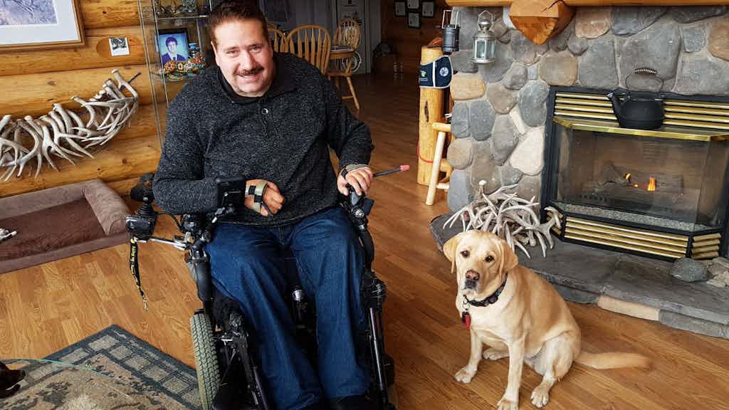 Individual in wheelchair with Service Dog