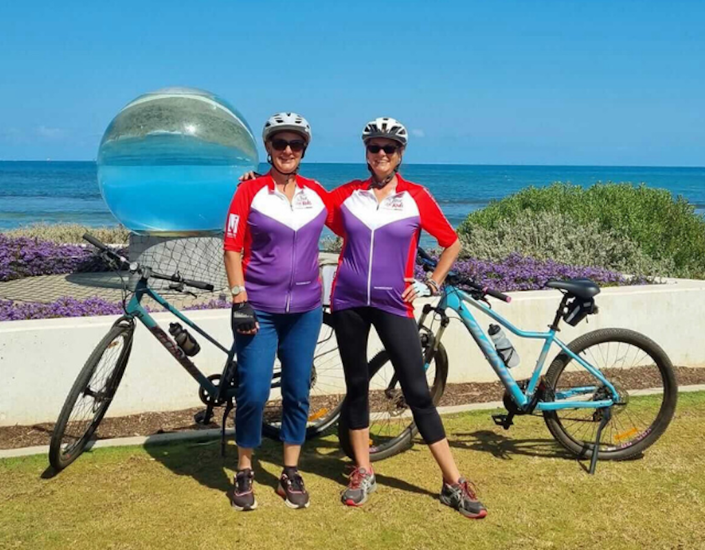 Two mates cycling cheering cycling